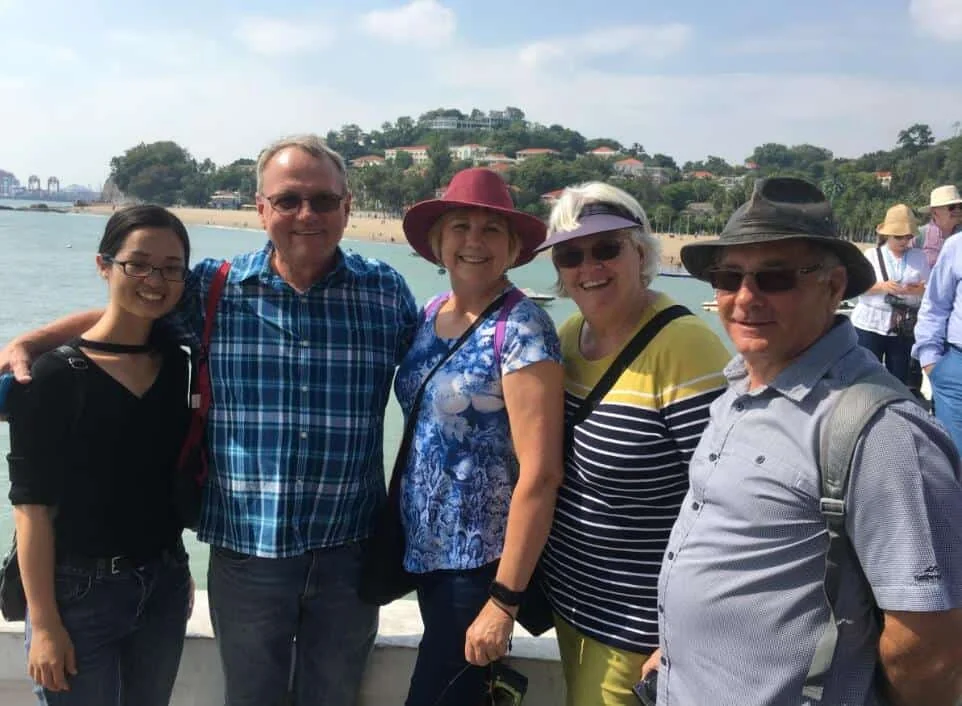 Selina Chen, English-Chinese interpreter, with clients on Gulangyu Island